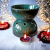 1. Duży kominek ceramiczny, ciemna zieleń, aromaterapia do olejk (1).png